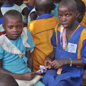 2 children holding a bracelet