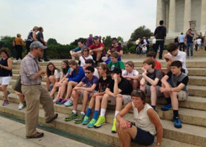 RLS Middle School students sitting on steps
