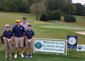Middle school golf championship banner with coach and kids