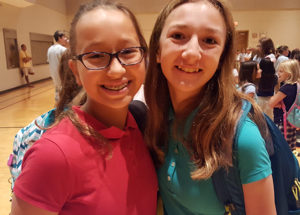 Two Middle School girls smiling